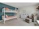 Charming bedroom with bunk beds, a white dresser, and soft decor at 1921 Hooker St, Denver, CO 80204
