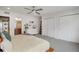 Spacious bedroom featuring a ceiling fan, carpet, double closets, and ensuite bath at 1921 Hooker St, Denver, CO 80204