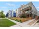 Contemporary townhome showcases a fenced yard, balcony, and street-side appeal within a modern community at 1921 Hooker St, Denver, CO 80204