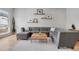 Bright living room featuring a gray sectional sofa, hardwood floors, and stylish decor, ideal for relaxation at 1921 Hooker St, Denver, CO 80204