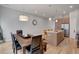 Open floor plan with a kitchen island, dining table and chairs, and hardwood flooring at 1921 Hooker St, Denver, CO 80204