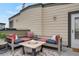 Cozy rooftop seating area with a fire pit and plush cushions, ideal for enjoying evenings outdoors at 1921 Hooker St, Denver, CO 80204