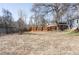 Large backyard with a wood fence and a shed that offers privacy and a serene outdoor space at 2030 Cody St, Lakewood, CO 80215