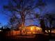 Cozy backyard featuring a charming patio with string lights and a well-maintained fence for privacy at 2030 Cody St, Lakewood, CO 80215