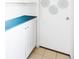 Bright mudroom features a blue countertop and white cabinet providing ample storage at 2030 Cody St, Lakewood, CO 80215