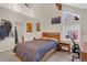 Bright bedroom with vaulted ceiling and a sleeping dog looking through one of the windows at 2885 Springdale Ln, Boulder, CO 80303