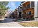 Exterior view of the townhome community with private balconies overlooking the green space at 2885 Springdale Ln, Boulder, CO 80303