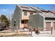 Charming multi-level townhouse featuring a fenced yard, inviting entryway, and a blend of wood and siding accents at 2885 Springdale Ln, Boulder, CO 80303