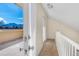 Hallway with white railing that provides access to the exterior balcony with mountain views at 2885 Springdale Ln, Boulder, CO 80303