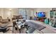 Comfortable living room with nice area rug, entertainment center, and sliding glass door access to a balcony at 2885 Springdale Ln, Boulder, CO 80303