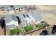 Aerial view of homes with well-manicured lawns and landscaping in a Gathering-friendly neighborhood with ample parking at 17548 E 103Rd Dr, Commerce City, CO 80022