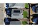 Overhead aerial view of a home featuring solar panels, a well-kept backyard, and neighboring houses in a tidy community at 17548 E 103Rd Dr, Commerce City, CO 80022