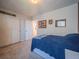 Cozy bedroom featuring neutral carpet, closet, and charming Michigan and Chicago sports memorabilia at 17548 E 103Rd Dr, Commerce City, CO 80022