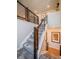 Modern staircase with carpeted steps and metal railings leading to the upper level, with light and airy feel at 17548 E 103Rd Dr, Commerce City, CO 80022