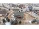 Aerial view of the property showcasing the large patio, deck and surrounding landscape at 7603 Yule Ct, Arvada, CO 80007