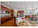 Well-lit kitchen features cherry cabinets, granite countertops, and stainless appliances at 7603 Yule Ct, Arvada, CO 80007