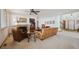 Cozy living room featuring a fireplace and comfortable leather furniture at 7603 Yule Ct, Arvada, CO 80007