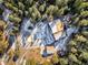An aerial shot shows the layout of the home, surrounding trees, and detached garage at 636 Chute Rd, Golden, CO 80403