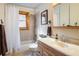 Bright bathroom featuring a shower and tub combination with wooden trim windows at 636 Chute Rd, Golden, CO 80403