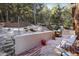 Cozy backyard deck perfect for relaxing or entertaining with wooded scenery at 636 Chute Rd, Golden, CO 80403