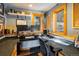 Bright home office featuring built-in desk, granite countertops, and natural light from two windows at 636 Chute Rd, Golden, CO 80403