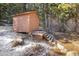 Exterior view of shed with wood siding, and stairs for access at 636 Chute Rd, Golden, CO 80403