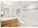 Bright bathroom features a vanity, tiled shower, tub, and decorative accents for a modern and clean space at 19377 E Radcliff Pl, Aurora, CO 80015