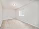 Neutral bedroom with carpet flooring features a window, bright lighting, and cozy space to personalize at 19377 E Radcliff Pl, Aurora, CO 80015