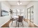 Cozy breakfast nook with a round table, modern chairs, natural light, and access to the patio at 19377 E Radcliff Pl, Aurora, CO 80015