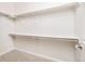 Bright, walk-in closet with carpet, white walls, and ample shelf and rod storage for organized living at 19377 E Radcliff Pl, Aurora, CO 80015
