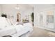 Inviting main bedroom with a door to a balcony, comfortable bed, and ample natural light at 19377 E Radcliff Pl, Aurora, CO 80015