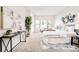 Bright and airy main bedroom with stylish decor, a comfortable bed, and plenty of natural light at 19377 E Radcliff Pl, Aurora, CO 80015