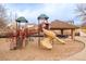 Community playground with slides, climbing structures, and covered picnic area for Gathering fun at 19377 E Radcliff Pl, Aurora, CO 80015