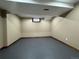 Finished basement room with neutral walls, dark trim, and a window bringing in natural light at 1625 N Downing St, Denver, CO 80218