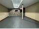 Basement room showcasing brick accents, modern lighting, and ample space for various activities at 1625 N Downing St, Denver, CO 80218