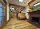 Spacious foyer with original hardwood floors, a fireplace, and a staircase at 1625 N Downing St, Denver, CO 80218