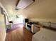 Compact kitchen features modern appliances and adjacent living space at 1625 N Downing St, Denver, CO 80218