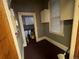 View of laundry room area with gray walls, a window, and storage cabinet at 1625 N Downing St, Denver, CO 80218
