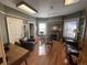 Comfortable living room showcasing a fireplace, hardwood floors, and natural light from several windows at 1625 N Downing St, Denver, CO 80218
