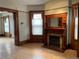Living room features hardwood floors, a bay window, and a decorative fireplace with a mirror at 1625 N Downing St, Denver, CO 80218