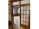 Bright living room view featuring hardwood floors and a decorative glass paneled doorway at 1625 N Downing St, Denver, CO 80218