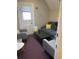 Small, cozy living room with comfortable seating, soft lighting, and a modern aesthetic, with exterior access at 1625 N Downing St, Denver, CO 80218