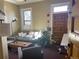 Living room area with a comfortable gray couch, wood-look coffee table, and natural light at 1625 N Downing St, Denver, CO 80218