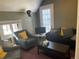 Cozy living room with comfortable seating, soft lighting, and a modern aesthetic, with views to the outside at 1625 N Downing St, Denver, CO 80218
