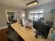 Large office space with hardwood floors, lots of natural light, and multiple work stations at 1625 N Downing St, Denver, CO 80218