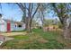 Large backyard with trees, grass, and potential to create your own outdoor oasis at 3278 S Lafayette St, Englewood, CO 80113
