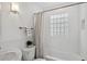 Bright bathroom with a tub and shower, tile surround, and modern fixtures at 3278 S Lafayette St, Englewood, CO 80113