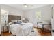 Bedroom boasting hardwood floors, neutral walls, with white linens and decor at 3278 S Lafayette St, Englewood, CO 80113