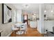 Dining area showcasing modern furniture with seamless access to a well-equipped kitchen with hardwood floors at 3278 S Lafayette St, Englewood, CO 80113