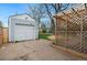 Detached one-car garage with ample parking space, accompanied by a lattice privacy screen at 3278 S Lafayette St, Englewood, CO 80113